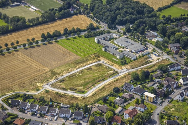 Aerial view, Peter and Paul retirement centre and construction site of a climate protection settlement in the new development area south of Methler village on Kiebitzweg in the Methler district, Kamen, Ruhr area, North Rhine-Westphalia, Germany, retirement home, old people's home, construction work, construction area, construction site, building plots, construction, construction project, construction site, care and nursing, DE, Europe, aerial view, aerial photography, aerial photography, new construction, care facility, retirement home, retirement home, retirement home, retirement centre, overview, bird's eye view, housing estate, birds-eyes view, overview