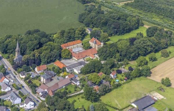 Aerial view, Heeren Castle and Heeren Protestant Church in Heeren-Werve, Kamen, Ruhr area, North Rhine-Westphalia, Germany, place of worship, DE, Europe, religious community, place of worship, moat, Heeren House, sacred site, church, parish, denomination, aerial view, aerial photography, aerial photography, religion, religious site, castle, overview, events, venue, event location, bird's-eye view, moated castle, birds-eyes view, overview