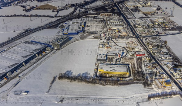 Aerial view, Kamen-Karree, commercial area Unna / Kamen, IKEA furniture store Kamen, Deutsche Post DHL, MechZB Kamen, ERL euro Retail Logistics, Mercure Hotel, 3M Deutschland GmbH - Werk Kamen, motorway junction Kamen-Zentrum Kamen, Ruhr area, North Rhine-Westphalia, Germany, motorway A1, motorway police, federal road B233, DE, Europe, gastronomy, commercial enterprises, commercial area, commercial area, commercial park, commercial location, commercial use, hotel, hotel facilities, hotel business, industrial area, industrial location, Kamen, aerial view, aerial photography, aerial photography, snow, overview, Unnaer Straße, bird's eye view, winter, delivery base, birds-eyes view, overview