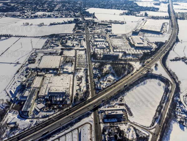 Aerial view, motorway junction Kamen-Zentrum, Kamen-Karree, commercial area Unna / Kamen, 3M Deutschland GmbH - Kamen plant, motorway police station Kamen, IKEA furniture store Kamen, ERL euro Retail Logistics, Kamen, Ruhr area, North Rhine-Westphalia, Germany, supervision, eye of the law, A1 motorway, motorway police, B233 federal road, DE, Europe, commercial enterprises, commercial area, commercial area, commercial park, commercial location, commercial use, industrial area, industrial location, aerial view, aerial photography, aerial photography, law enforcement, police, police station, police station, snow, state authority, state power, overview, Unnaer Straße, bird's eye view, winter, birds-eyes view, overview