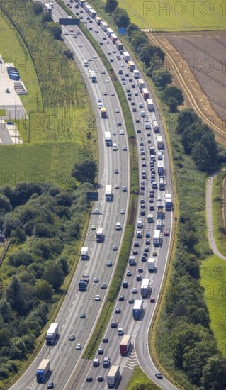 Aerial photo, traffic volume on the A1 motorway in Südkamen, truck traffic jam, Kamen, Ruhr area, North Rhine-Westphalia, Germany, motorway, DE, Europe, freight traffic, aerial photo, aerial photography, aerial photography, passenger traffic, road traffic, overview, traffic, traffic volume, bird's eye view, bird's eye view, overview