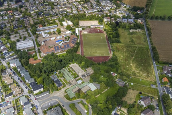 Aerial view, sports field school centre, Clara-Schumann-Gymnasium with solar roof, Josef Reding Schule, Karl-Brauckmann-Schule, Freiberg, Holzwickede, Ruhr area, North Rhine-Westphalia, Germany, education, educational institution, DE, Europe, football pitch, football stadium, grammar school, teaching institute, athletics stadium, aerial view, aerial photography, aerial photography, school, sports, sports facilities, sports field, sports facility, stadium, overview, bird's eye view, birds-eyes view, overview
