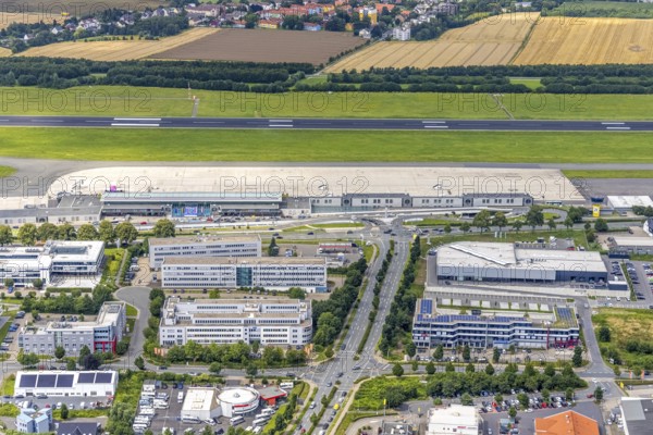 Aerial photograph, Dortmund Airport with new Porsche Centre, Natorp, Holzwickede, Ruhr area, North Rhine-Westphalia, Germany, terminal building, DE, reception building, Europe, flight emission, airport, aircraft noise, airfield, aerial photograph, aerial photography, aerial photography, overview, bird's-eye view, overview