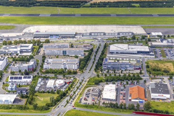 Aerial photograph, Dortmund Airport with new Porsche Centre, Natorp, Holzwickede, Ruhr area, North Rhine-Westphalia, Germany, terminal building, DE, reception building, Europe, flight emission, airport, aircraft noise, airfield, aerial photograph, aerial photography, aerial photography, overview, bird's-eye view, overview