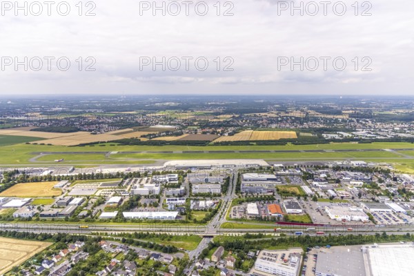 Aerial photograph, Dortmund Airport with new Porsche Centre, Natorp, Holzwickede, Ruhr area, North Rhine-Westphalia, Germany, terminal building, DE, reception building, Europe, flight emission, airport, aircraft noise, airfield, aerial photograph, aerial photography, aerial photography, overview, bird's-eye view, overview