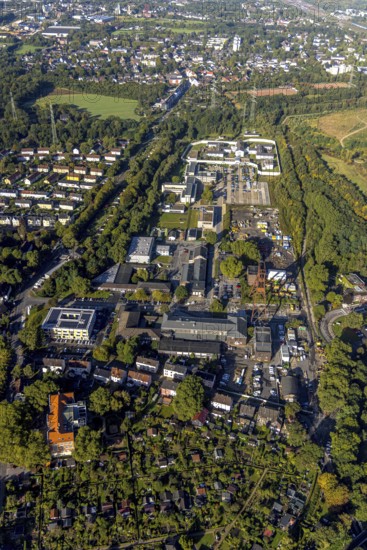 Aerial view, Wilhelmstraße industrial estate with winding tower of the former Pluto colliery and Herne prison in the Wanne district of Herne, Ruhr area, North Rhine-Westphalia, Germany, DE, Europe, imprisonment, detention, detention centre, Herne, correctional facility, aerial photograph, aerial photography, aerial photography, overview, custody, bird's-eye view, colliery site, birds-eyes view, overview