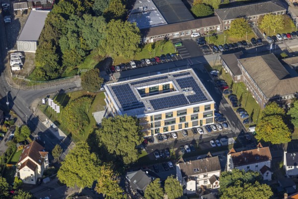 Aerial view, new building with solar roof of the company headquarters of the Heitkamp Group on the Pluto site on Wilhelmstraße in the Wanne district of Herne, Ruhr area, North Rhine-Westphalia, Germany, DE, Europe, commercial enterprises, commercial area, commercial area, commercial location, commercial use, Herne, aerial view, aerial photography, aerial photography, new building, photovoltaics, photovoltaic system, solar, solar system, solar roof, solar energy, overview, bird's eye view, birds-eyes view, overview