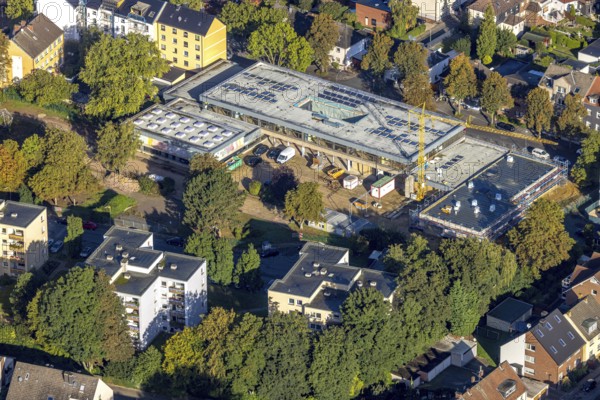 Aerial view, construction site with renovation and extension of the Claudius School in the Wanne district of Herne, Ruhr area, North Rhine-Westphalia, Germany, construction work, construction area, building site, building plots, construction project, construction site, education, educational institution, DE, Europe, primary school, Herne, teaching institute, aerial photograph, aerial photography, aerial photography, renovation, refurbishment, overview, bird's-eye view, overview