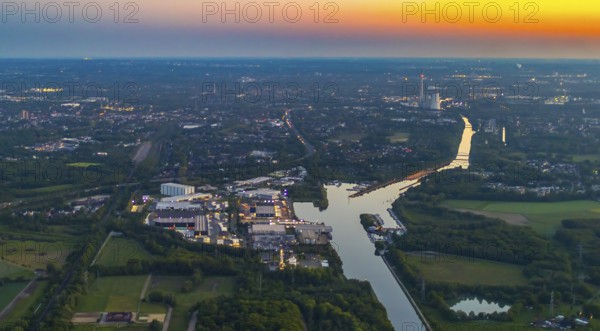 Aerial view, Herner Meer, Rhine-Herne Canal, Friedrich der Große industrial estate, Herne-East lock, STEAG Herne thermal power station, Pöppinghausen, Castrop-Rauxel, Ruhr area, North Rhine-Westphalia, Germany, sunset, DE, twilight photography, Europe, commercial enterprises, commercial area, industrial estate, industrial park, commercial location, commercial use, IGZ Herne, industrial area, industrial building, industrial location, power plant, light pollution, aerial photography, aerial photography, aerial photography, night, night photography, night flight, airlock, overview, bird's eye view, illuminated streets, birds-eyes view, nightflight, overview