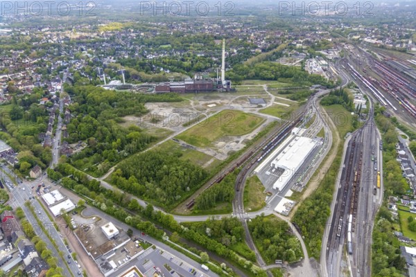 Aerial view, construction site of new Stadler Rail Vehicles branch, former General Blumenthal mine site, former Uniper Shamrock power plant, Wanne-Süd, Herne, Ruhr area, North Rhine-Westphalia, Germany, railway tracks, railway station, DE, Deutsche Bahn AG, Europe, commercial enterprises, commercial area, commercial area, commercial location, commercial use, main station, industrial facilities, industrial area, industrial location, Kastanienallee, aerial view, aerial photography, aerial photography, Rhine-Ruhr metropolitan region, signal box, overview, bird's-eye view, Wanne-Eickel main station, birds-eyes view, overview