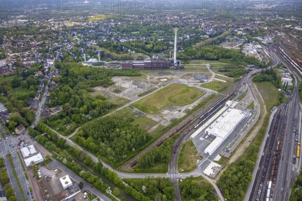 Aerial view, construction site of new Stadler Rail Vehicles branch, former General Blumenthal mine site, former Uniper Shamrock power plant, Wanne-Süd, Herne, Ruhr area, North Rhine-Westphalia, Germany, railway tracks, railway station, DE, Deutsche Bahn AG, Europe, commercial enterprises, commercial area, commercial area, commercial location, commercial use, main station, industrial facilities, industrial area, industrial location, Kastanienallee, aerial view, aerial photography, aerial photography, Rhine-Ruhr metropolitan region, signal box, overview, bird's-eye view, Wanne-Eickel main station, birds-eyes view, overview