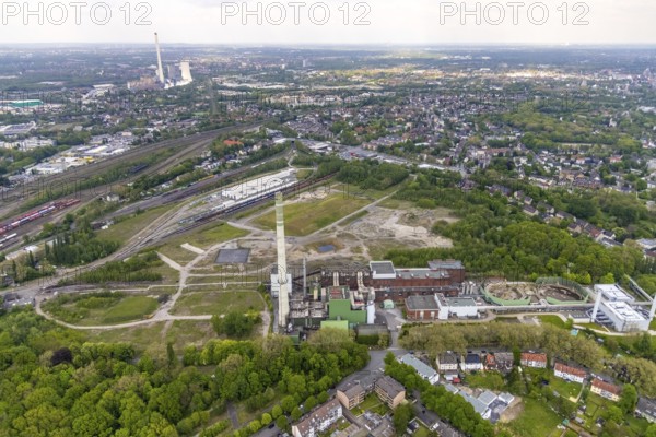 Aerial view, construction site of new Stadler Rail Vehicles branch, former General Blumenthal mine site, former Uniper Shamrock power plant, Wanne-Süd, Herne, Ruhr area, North Rhine-Westphalia, Germany, railway tracks, railway station, DE, Deutsche Bahn AG, Europe, commercial enterprises, commercial area, commercial area, commercial location, commercial use, main station, industrial facilities, industrial area, industrial location, Kastanienallee, aerial view, aerial photography, aerial photography, Rhine-Ruhr metropolitan region, signal box, overview, bird's-eye view, Wanne-Eickel main station, birds-eyes view, overview