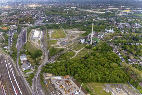 Aerial view, construction site of new Stadler Rail Vehicles branch, former General Blumenthal mine site, former Uniper Shamrock power plant, Wanne-Süd, Herne, Ruhr area, North Rhine-Westphalia, Germany, railway tracks, railway station, DE, Deutsche Bahn AG, Europe, commercial enterprises, commercial area, commercial area, commercial location, commercial use, main station, industrial facilities, industrial area, industrial location, Kastanienallee, aerial view, aerial photography, aerial photography, Rhine-Ruhr metropolitan region, signal box, overview, bird's-eye view, Wanne-Eickel main station, birds-eyes view, overview