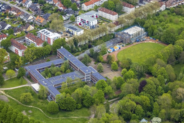 Aerial view, Otto-cock-Gymnasium with construction site indoor swimming pool, Sodingen, Herne, Ruhr area, North Rhine-Westphalia, Germany, construction work, construction, construction area, building site, building plots, construction measure, construction project, construction site, education, educational institution, DE, Europe, grammar school, indoor swimming pool, educational institute, aerial view, aerial photography, aerial photography, Rhine-Ruhr metropolitan region, photovoltaic, photovoltaic system, school, solar, solar system, solar energy, solar energy, overview, bird's-eye view, birds-eyes view, overview