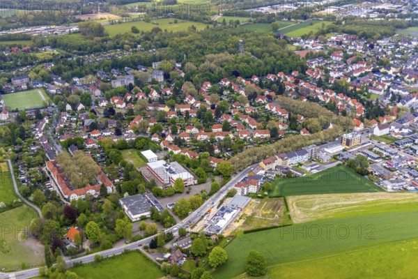 Aerial view, housing estate Gartenstadt Teutoburgia, colliery housing estate, Teutoburgiahof, Sodingen secondary school, construction site on Castroper Straße, Börnig, Herne, Ruhr area, North Rhine-Westphalia, Germany, workers' housing estate, Baarestraße, construction work, building, construction area, building site, building plots, construction measure, construction project, construction site, education, educational institution, DE, monument protection, Europe, property tax, green areas, green trees, gardens, real estate, educational institute, aerial view, aerial photography, aerial photography, multi-family houses, metropolitan region Rhine-Ruhr, new building, secondary school, school, sight, overview, bird's eye view, residential complex, living and life, residential area, residential houses, residential quality, residential neighbourhood, housing estate, housing estate Teutoburgia, birds-eyes view, overview, red roofs