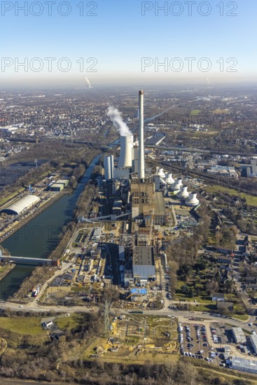 Aerial photo, power generation at the STEAG Herne combined heat and power plant on the Rhine-Herne Canal, Baukau-West, Herne, Ruhr area, North Rhine-Westphalia, Germany, construction work, construction, construction area, building site, building plots, construction project, construction site, DE, vapour cloud, E-Werk, Europe, district heating, CCGT power plant, Hertener Straße, power plant, aerial view, aerial photography, aerial photography, Rhine-Ruhr metropolitan region, new construction, smoke cloud, coal-fired power plant, overview, bird's-eye view, overview