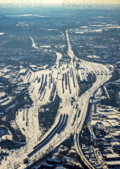 Aerial view, Wanne-Eickel main station, signal box, railway tracks in the snow, Baukau-West, Herne, Ruhr area, North Rhine-Westphalia, Germany, railway tracks, station, DE, Deutsche Bahn AG, Europe, railway tracks, goods trains, main station, central station, aerial view, aerial photography, aerial photography, snow, overview, bird's eye view, winter, birds-eyes view, overview