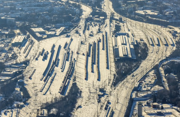 Aerial view, Wanne-Eickel main station, signal box, railway tracks in the snow, Baukau-West, Herne, Ruhr area, North Rhine-Westphalia, Germany, railway tracks, station, DE, Deutsche Bahn AG, Europe, railway tracks, goods trains, main station, central station, aerial view, aerial photography, aerial photography, snow, overview, bird's eye view, winter, birds-eyes view, overview
