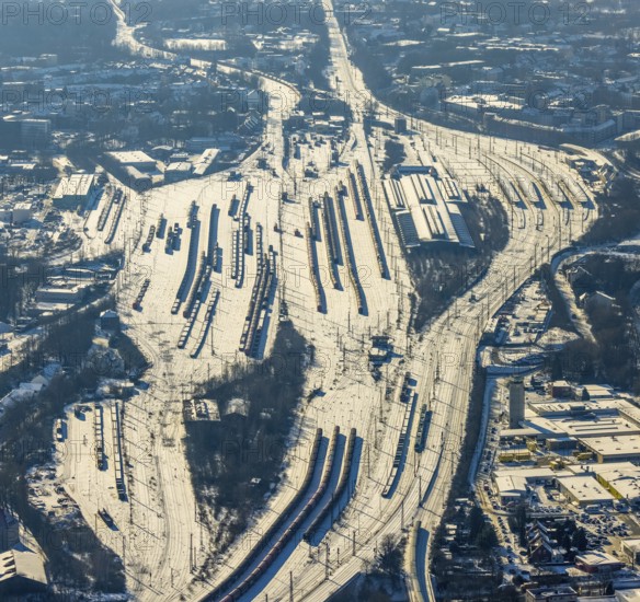 Aerial view, Wanne-Eickel main station, signal box, railway tracks in the snow, Baukau-West, Herne, Ruhr area, North Rhine-Westphalia, Germany, railway tracks, station, DE, Deutsche Bahn AG, Europe, railway tracks, goods trains, main station, central station, aerial view, aerial photography, aerial photography, snow, overview, bird's eye view, winter, birds-eyes view, overview