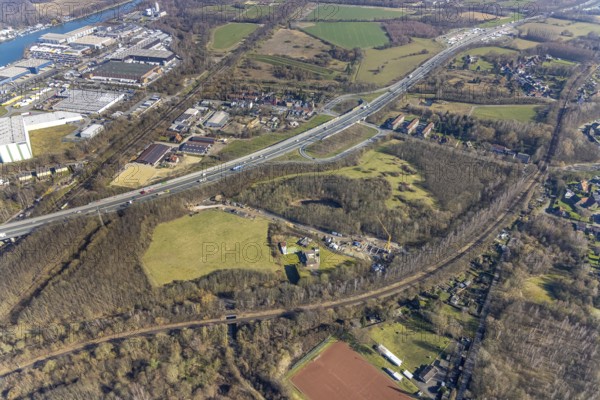 Aerial view, nature reserve Voßnacken, motorway A42, motorway junction Herne-Börnig, Börnig, Herne, Ruhr area, North Rhine-Westphalia, Germany, construction work, construction area, building site, building plots, construction project, construction site, DE, Europe, aerial view, aerial photography, aerial photography, nature reserve, electricity pylons, overview, bird's-eye view, overview