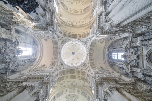 An impressive baroque ceiling with dome and ornamental decorations in a church, Munich, Germany