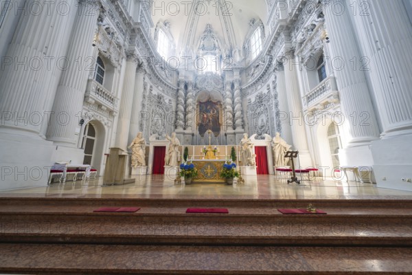 Magnificent baroque church interior with an ornate altar and lavish details, Munich, Germany