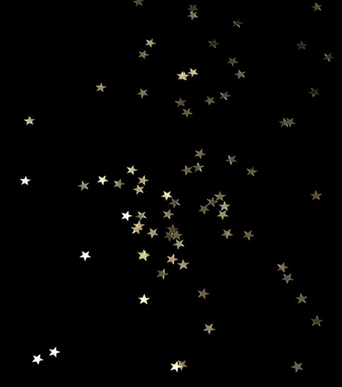 Punched small metallic stars falling in front of black back