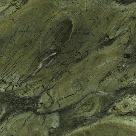 Full frame closeup shot showing a green marbled stone surface