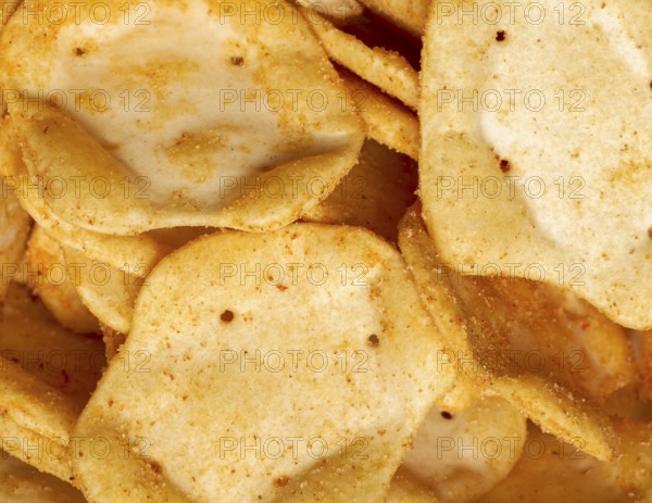 Full frame closeupof some baked crisp salty snack pieces
