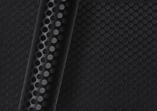 Rolled dark round dotted surface over same full frame textured background