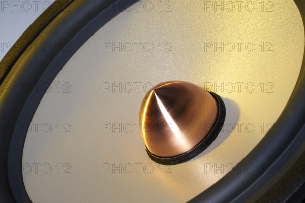 A yellow illuminated loudspeaker detail