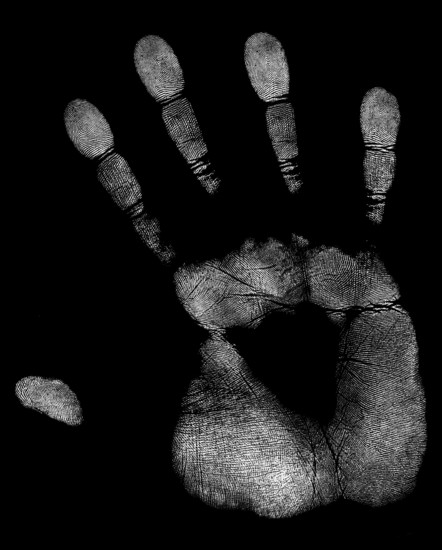 A white handprint of a right hand in black back