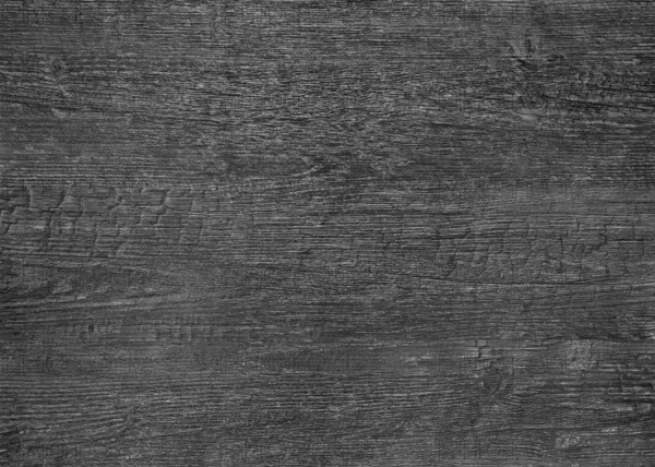 A full frame dark burnt wood grain surface