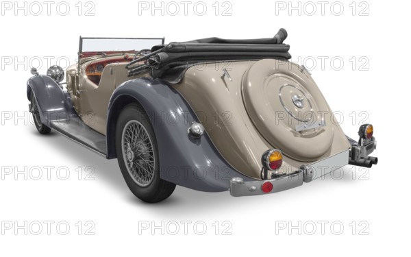 Rear view of a classic car isolated in white back with shadow