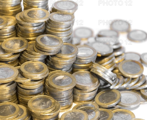 Lots of stacked 1 euro coins