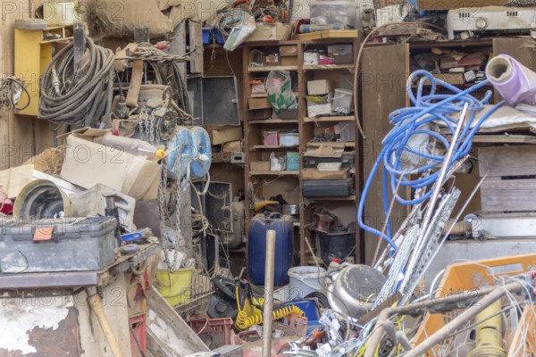 A messy garage detail filled with various things