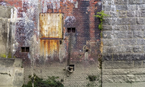 Rundown weathered quai wall seen at the Port of Hamburg