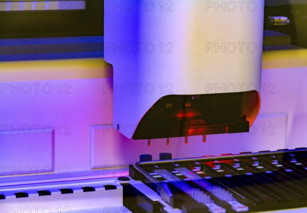 Colorful illuminated detail of a medical apparatus in a laboratory