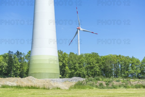 Wind turbines in sunny rural landscape