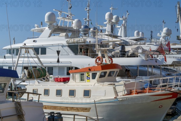 Harbor scenery with some yachts seen in Imperia, a coastal city in Liguria, Italy