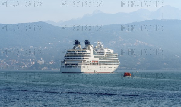Cruise ship seen in Liguria, a region of north-western Italy in misty ambiance