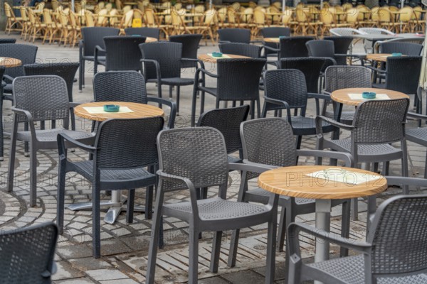 Outdoor scenery with tables and chairs seen in Normandy, France