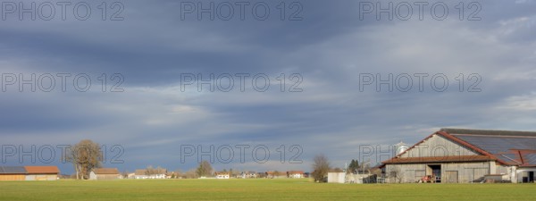 Panoramic agricultural scenery in Bavaria at evening time