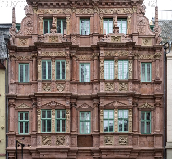 City view of Heidelberg showing a historic house facade in Germany at summer time