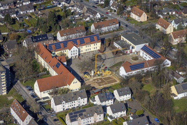 Aerial view, construction site at the Südparkschule, Brauck, Gladbeck, Ruhr area, North Rhine-Westphalia, Germany, construction work, construction area, construction site, building plots, construction crane, construction measure, construction project, construction site, education, educational institution, DE, Europe, primary school, teaching institute, aerial view, aerial photography, aerial photography, photovoltaics, photovoltaic system, school, solar, solar system, solar energy, solar energy, overview, bird's eye view, birds-eyes view, overview