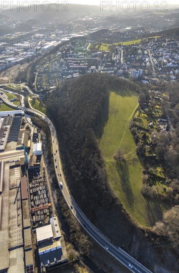 Aerial view, railway station rear view, commercial area Wehringhauser Straße, forest area Postkopf, residential area Kuhlerkamp, Cunosiedlung, Wehringhausen, Hagen, Ruhr area, North Rhine-Westphalia, Germany, bridge, federal road B54, DE, through station, Europe, long-distance railway station, property tax, freight traffic, real estate, aerial view, aerial photography, aerial photography, passenger traffic, regional railway station, suburban railway station, overview, bird's-eye view, housing estate, housing and living, residential area, residential buildings, housing quality, residential neighbourhood, housing estate, birds-eyes view, overview