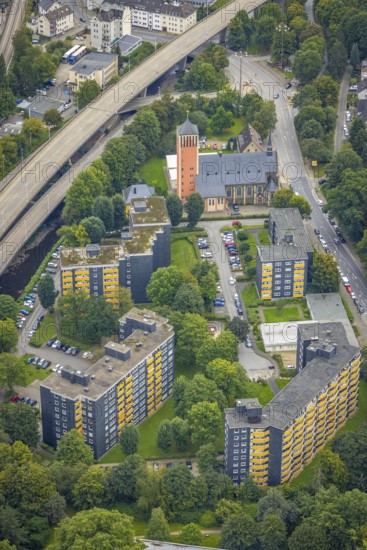 Aerial view, high-rise buildings and Catholic Church of the Sacred Heart of Jesus in the Eilpe district of Hagen, Ruhr area, North Rhine-Westphalia, Germany, place of worship, DE, Europe, religious community, place of worship, property tax, Hagen, sacred site, high-rise buildings, real estate, church, church community, denomination, aerial view, aerial photography, aerial photography, multi-family houses, religion, religious site, overview, bird's eye view, residential complex, living and life, residential buildings, housing estate, birds-eyes view, overview
