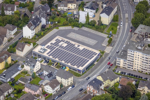 Aerial view, Aldi supermarket with solar roof on Esserstrasse in the Hohenlimburg district, Hagen, Ruhr area, North Rhine-Westphalia, Germany, DE, shopping square, shopping centre, Europe, aerial view, aerial photography, aerial photography, local supply centre, photovoltaic, photovoltaic system, solar, solar system, solar roof, solar energy, supermarket, overview, bird's-eye view, bird's-eye view, overview