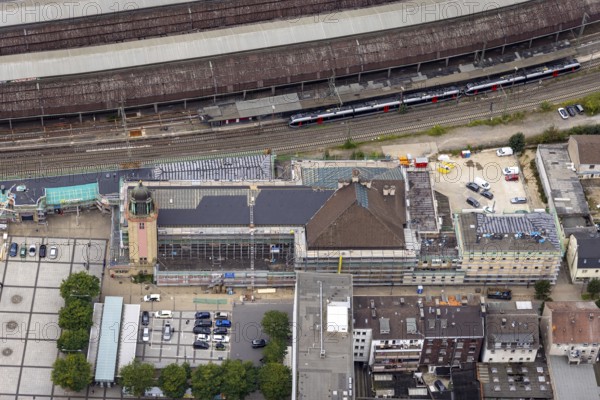 Aerial view, Hagen main station construction site with renovation in the district Mittelstadt in Hagen, Ruhr area, North Rhine-Westphalia, Germany, railway station, construction work, construction area, construction site, building site, construction project, construction site, DE, Deutsche Bahn AG, Europe, Hagen, main station, central station, aerial view, aerial photography, aerial photography, renovation, overview, bird's-eye view, overview
