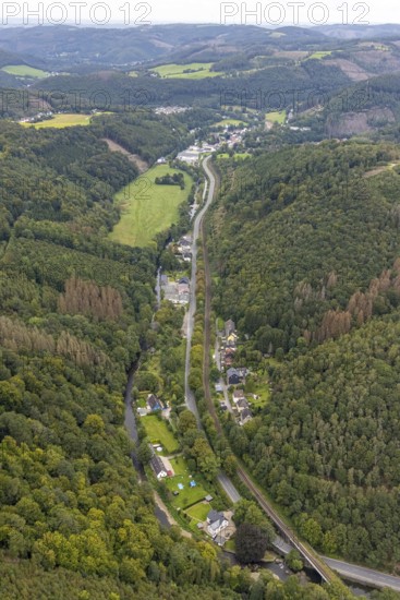 Aerial view, forest area and Rummenohler Straße with railway line in the valley at the river Volme in the district Rummenohl in Hagen, Ruhr area, North Rhine-Westphalia, Germany, DE, Europe, Hagen, hilly landscape, aerial view, aerial photography, aerial photography, overview, bird's eye view, birds-eyes view, overview